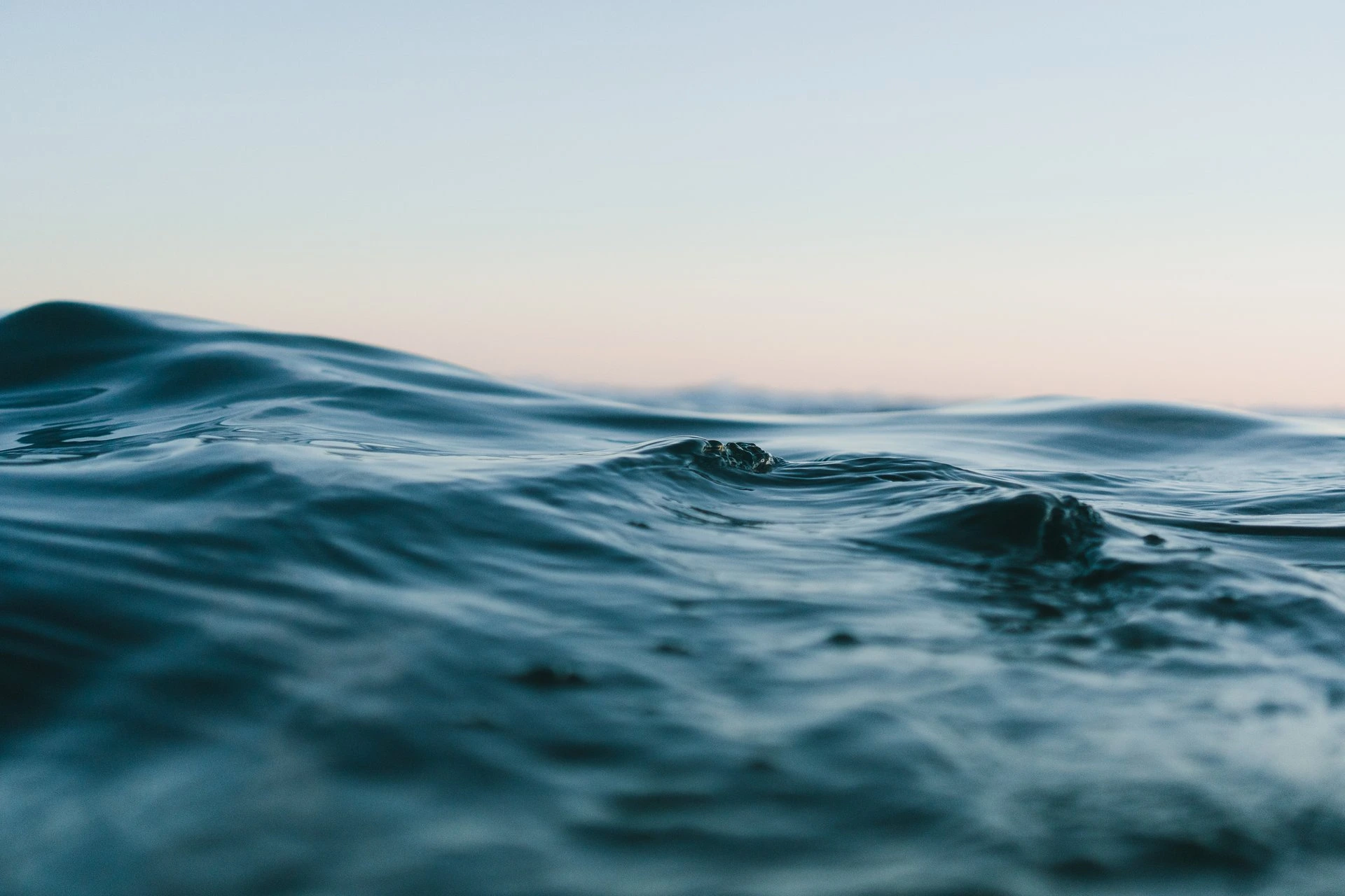 body-of-water-under-blue-and-white-skies